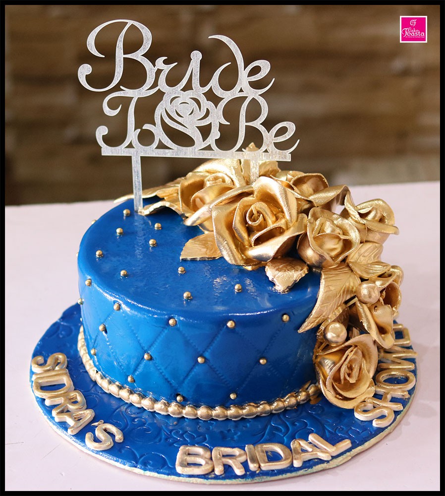 1575355871-gold-flowers-blue-bridal-cake.jpg